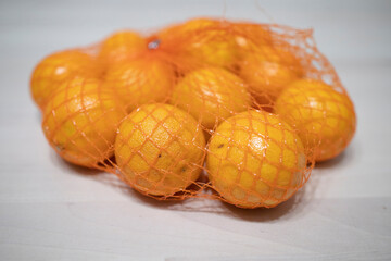 tangerines in a grid on the table. Food poisoning, allergy to citrus fruits, vitamins, immunity