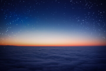 Starry sky above the clouds. Wonderful night landscape.