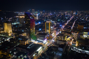 Obraz na płótnie Canvas Top View of Building in a City - Aerial view Skyscrapers flying by drone of Phnom Penh city with downtown , riverside and sunset