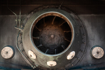The back of a yacht with a water jet engine in the form of a turbine and zinc anodes on the hull to...
