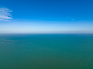 lonely faraway, the empty ocean seperate half frame water and cloud blue sky