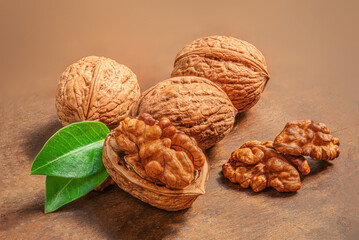 Walnuts on dark wooden  table. Fresh nuts kernels closeup