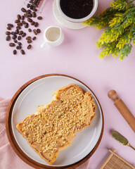 roti bakar is usually prepared as a sandwich of grilled white bread with a filling, consumed both as a light breakfast and a common street food. 