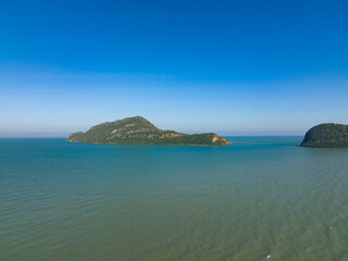 lonely faraway, the empty ocean seperate half frame water and cloud blue sky with little island town
