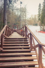 Wooden steps in the forest at a ski resort. Wooden road in the forest.