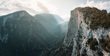 Aerial dramatic view of deep gorge and rocky canyon near legendary Mountain Olympus - the pantheon...