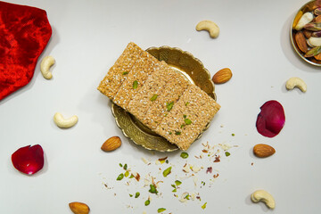 Top View Of Indian Sweets Gajak With Scattered Dry Fruits