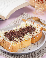 roti bakar is usually prepared as a sandwich of grilled white bread with a filling, consumed both as a light breakfast and a common street food. 