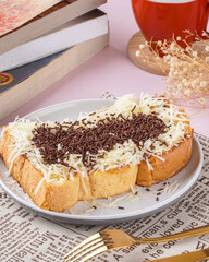 roti bakar is usually prepared as a sandwich of grilled white bread with a filling, consumed both as a light breakfast and a common street food. 