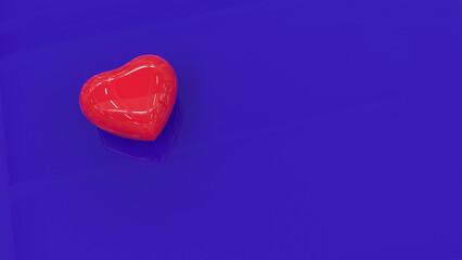 A red shiny heart on a blue reflective surface. Plastic heart on a blue background. 3D image.