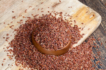 raw uncooked red rice, unpeeled