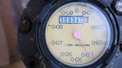 Close-up of dirty water meter. There is a copy space. Selective focus