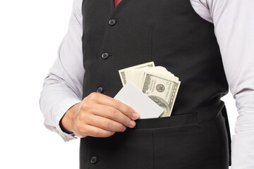 Handsome business man in black suit put or take out credit card and money in pocket isolated on...