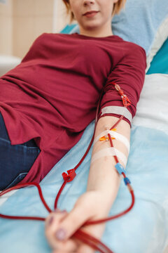 Young beautiful girl, during hemodialysis in hospital, dialysis system equipment, habitual routine for chronic patient, lifestyle, medical concept