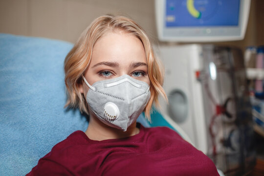 Portrait Of Young Beautiful Girl In Medical Mask On Hemodialysis In Hospital, Dialysis System Equipment, Habitual Routine For Chronic Patient, Lifestyle, Medical Concept