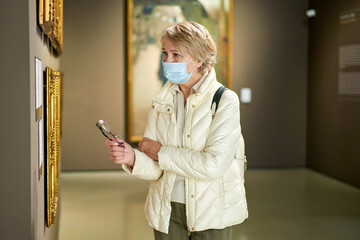 portrait of elegant woman wearing masks modern art gallery