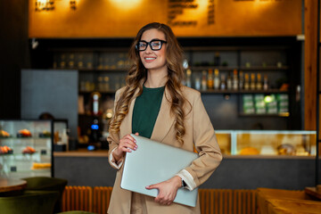 Business Woman Restaurant Owner With Laptop In Hands Dressed Elegant Pantsuit Standing In...