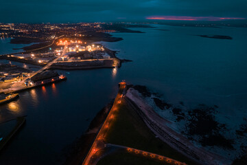 Galway city illuminated at night Nimmo's pier. Aerial high point view. Dark scene. Town at night....
