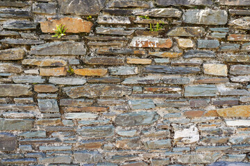 Stone castle wall texture. With grey and orange color stone. Design background