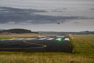 Silhouette of a small one engine airplane taking off from a small country airport. Aviation...