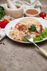 Delicious chicken aspic on a plate on concrete table