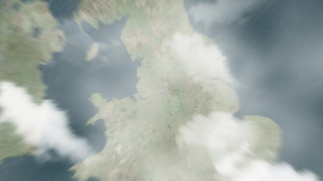Earth zoom in from outer space to city. Zooming on United Kingdom, Manchester. The animation continues by zoom out through clouds and atmosphere into space. Images from NASA. 4K