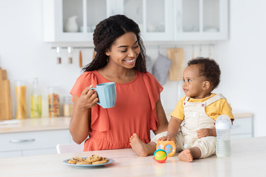 Happy Black Family Mom And Infant Son Spending Time In Kitchen