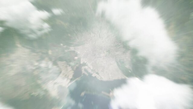 Earth zoom in from outer space to city. Zooming on Kingston, Jamaica. The animation continues by zoom out through clouds and atmosphere into space. View of the Earth at night. Images from NASA. 4K