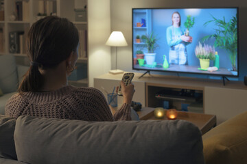 Woman watching a TV show about gardening