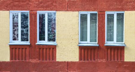 Fototapeta na wymiar The old red house. Four windows. Vintage