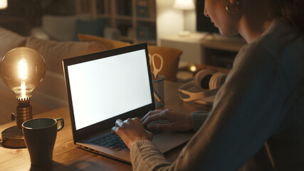 Woman working with her laptop at night