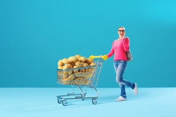 Tiny woman pushing a full shopping cart