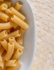 raw pasta rigatoni top view.