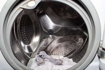 Inside the drum of a washing machine.