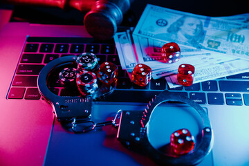Handcuffs, gavel and dice. Illegal casino concept
