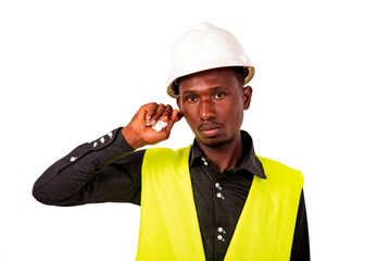 young man engineer holding finger in ear.
