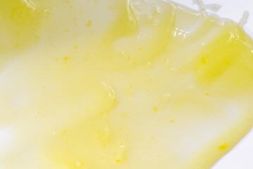 Fototapeta na wymiar Liquid gel cosmetic smudge yellow