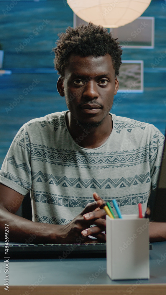 Poster adult of african ethnicity using computer for remote work and typing on keyboard. businessman workin