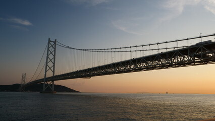 海に架かる橋の夕景。
