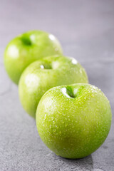 Green apples on the table.