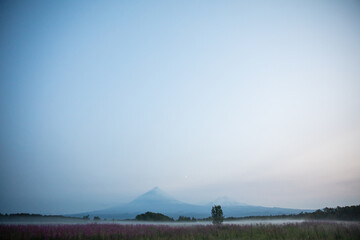 The active Kamchatka Volcano Klyuchevskaya Sopka at dawn