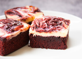 Closeup red velvet brownie cheese cake on white plate. Favorite dessert for chocolate lover.