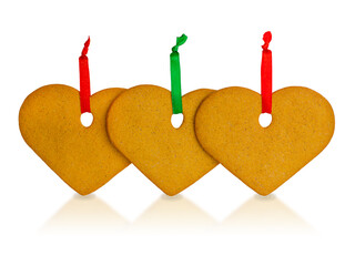 The gingerbread hearts hanging on rope isolated