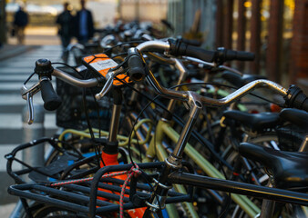 Bicycles parked on a street in Copenhagen. Shallow depth of field.