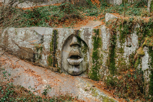 Rock relief called Usta pravdy,Mouth of Truth, in forest near Lipnice nad Sazavou,Czech Republic,inspired by Bocca della Verita.Tourist destination in Czech countryside.outdoor modern art