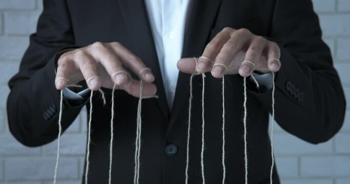 Business work under control. A business worker like a manipulate controll the work on his employees in the office.