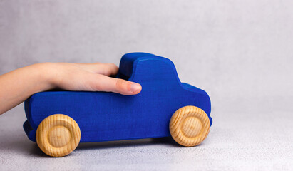 Wooden toy car on white background.