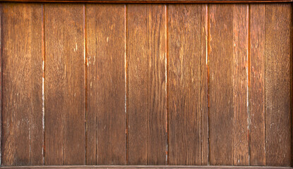 Old yellow wooden wall, aged in the rain and sun.