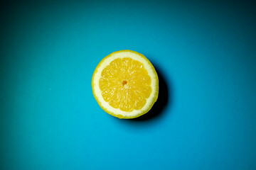 half Citrus lemons on a blue background