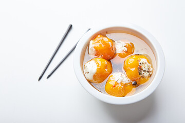 Pickled hot yellow tiny cherry peppers stuffed with soft cream or ricotta cheese. Delicious snack